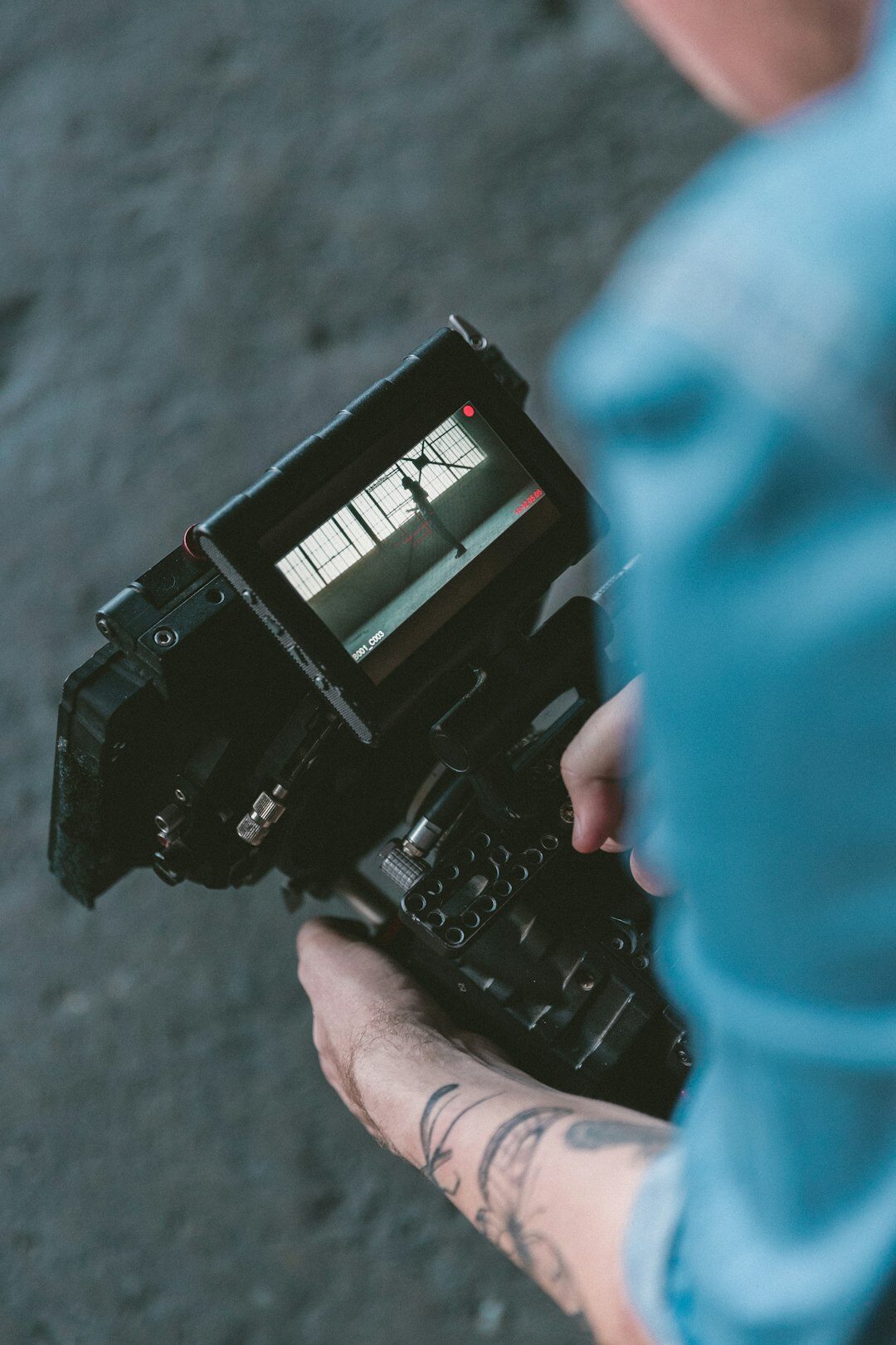 modern videographer with camera